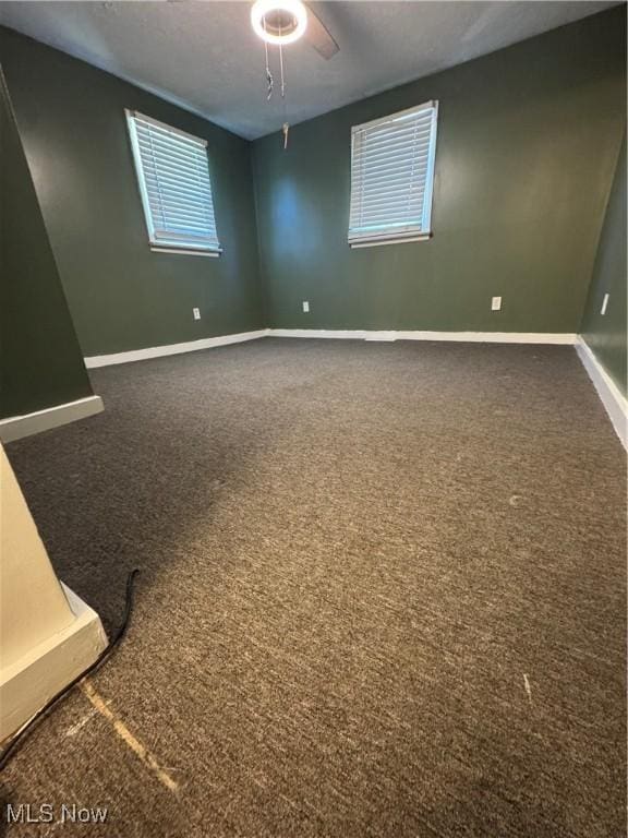 4940 State Route 26, Marietta, OH 45750 - empty room with dark carpet and baseboards