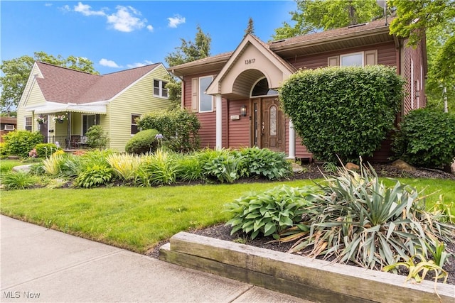 13817 Lakewood Heights Blvd, Lakewood, OH 44107 - view of front facade with a front lawn