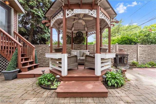 13817 Lakewood Heights Blvd, Lakewood, OH 44107 - fenced backyard featuring an outdoor living space, a gazebo, a deck, and stairs
