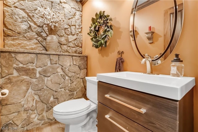 13817 Lakewood Heights Blvd, Lakewood, OH 44107 - bathroom with vanity, toilet, and wood finished floors