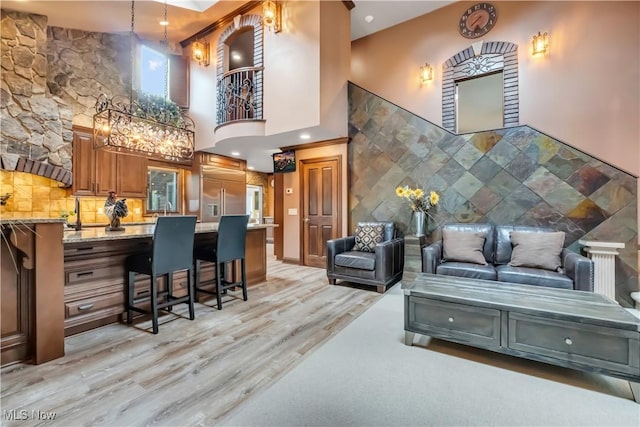 13817 Lakewood Heights Blvd, Lakewood, OH 44107 - living room with light wood finished floors and a high ceiling