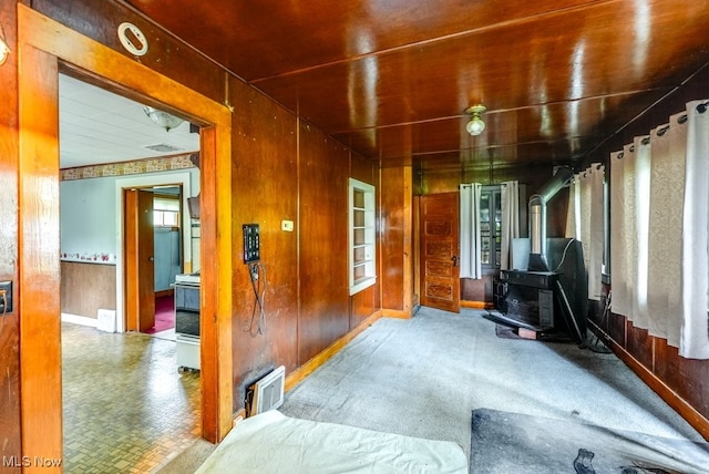 14721 Zenith Dr, Newbury, OH 44065 - interior space featuring a wood stove and wood walls
