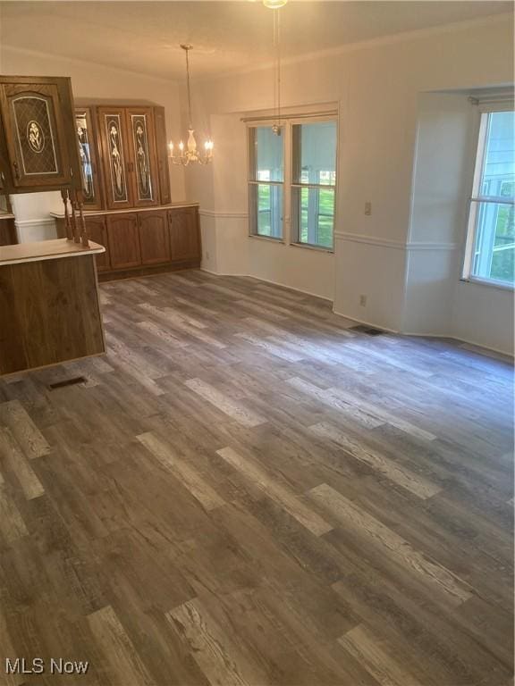 1229 Columbiana Lisbon Rd Unit 39, Columbiana, OH 44408 - unfurnished dining area featuring dark wood finished floors, a chandelier, and crown molding