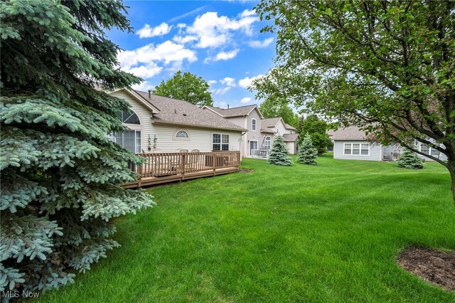 6811 Meadow Ln, Cleveland, OH 44130 - view of green lawn with a deck