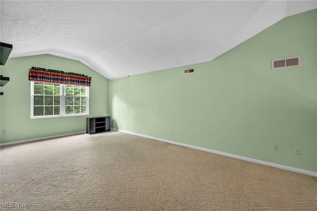 6811 Meadow Ln, Cleveland, OH 44130 - unfurnished living room with vaulted ceiling, carpet, baseboards, and a textured ceiling