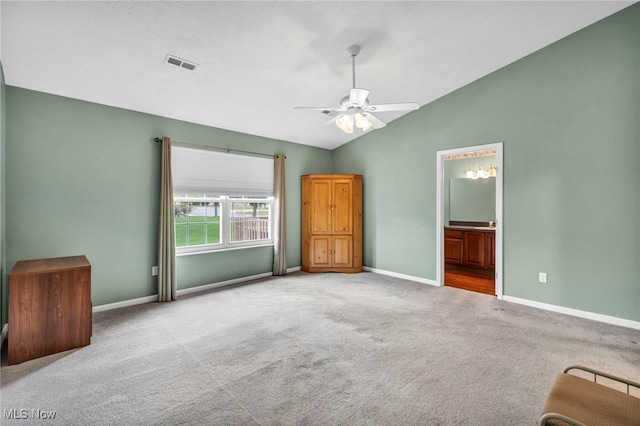 6811 Meadow Ln, Cleveland, OH 44130 - unfurnished bedroom featuring carpet, lofted ceiling, baseboards, connected bathroom, and a ceiling fan