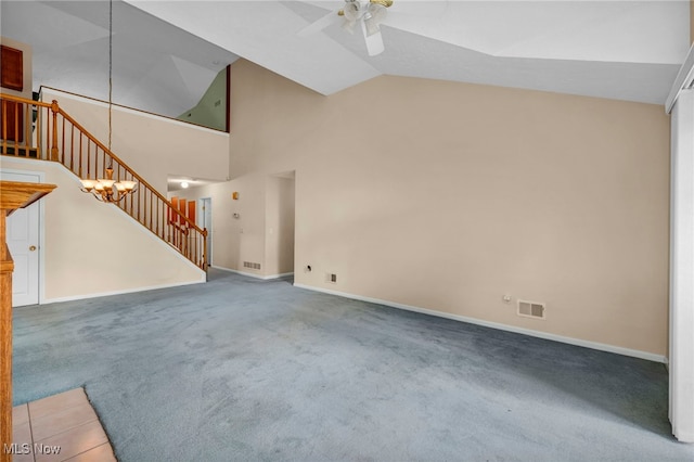 6811 Meadow Ln, Cleveland, OH 44130 - unfurnished living room with ceiling fan, stairway, carpet flooring, baseboards, and high vaulted ceiling