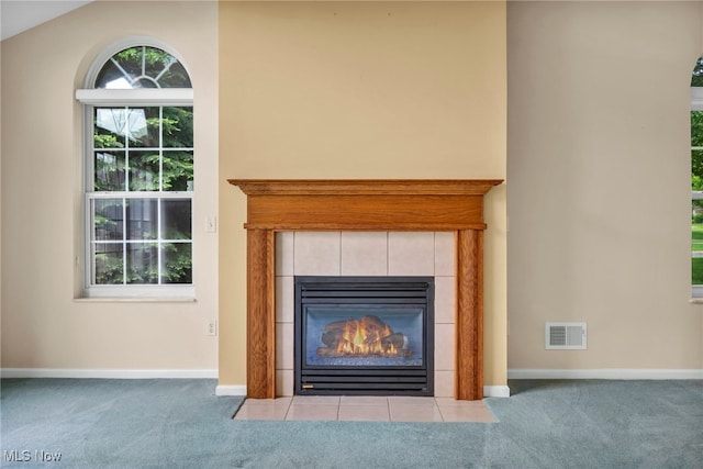 6811 Meadow Ln, Cleveland, OH 44130 - detailed view of carpet flooring, a tile fireplace, and baseboards