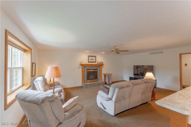 6951 Bunbury Ln, Concord, OH 44077 - living room featuring a ceiling fan, a fireplace, carpet flooring, and baseboards