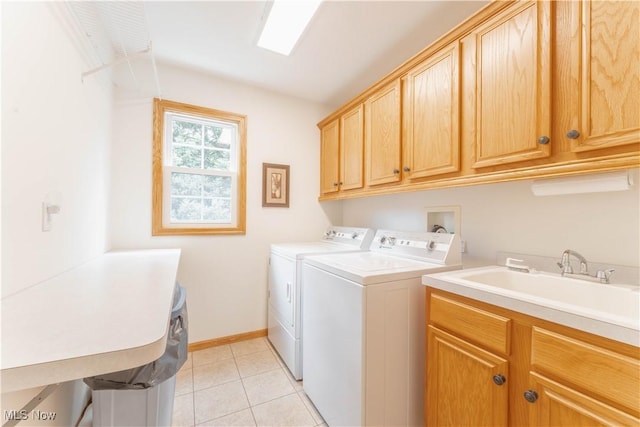 6951 Bunbury Ln, Concord, OH 44077 - laundry room with cabinet space, washer and dryer, light tile patterned flooring, and baseboards