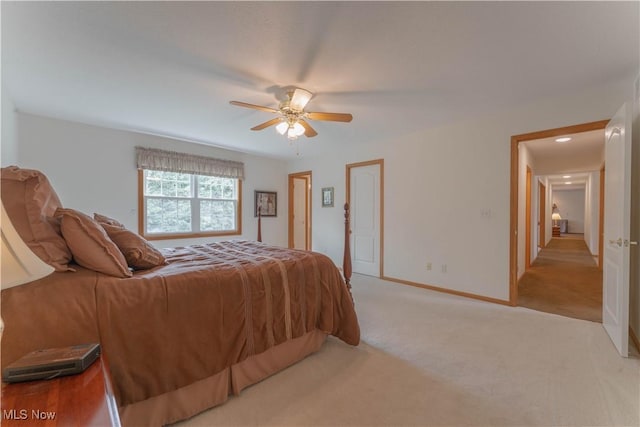 6951 Bunbury Ln, Concord, OH 44077 - bedroom with light carpet, baseboards, and a ceiling fan