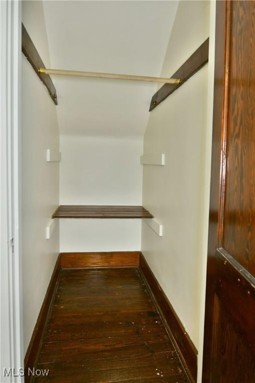 328 S Canal St, Newton Falls, OH 44444 - spacious closet featuring dark wood finished floors and vaulted ceiling