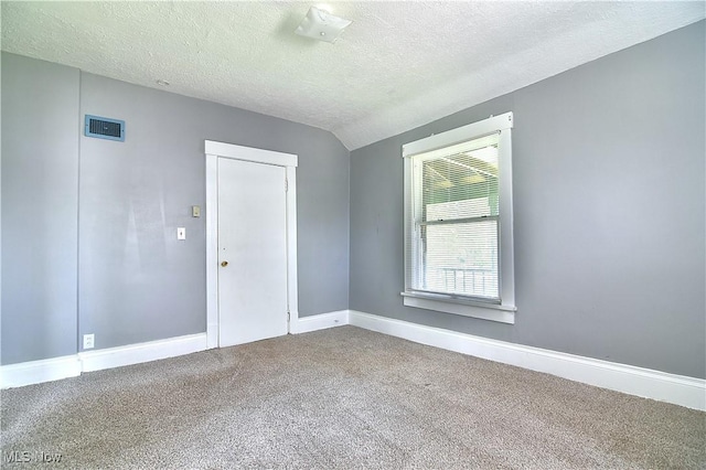 1033 Monnot Pl NW, Canton, OH 44703 - carpeted empty room with a textured ceiling and baseboards