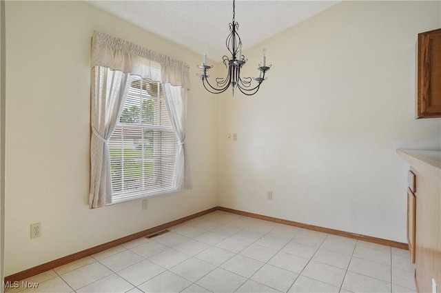 820 Southwestern Run Unit 43, Poland, OH 44514 - unfurnished dining area with a chandelier and baseboards