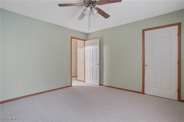 820 Southwestern Run Unit 43, Poland, OH 44514 - unfurnished bedroom with light carpet, baseboards, a ceiling fan, and a textured ceiling