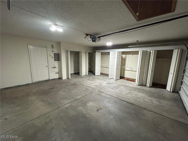 820 Southwestern Run Unit 43, Poland, OH 44514 - garage with a garage door opener and electric panel