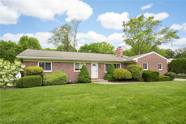 206 Benson Rd, Akron, OH 44333 - ranch-style house with a chimney, a front lawn, and brick siding