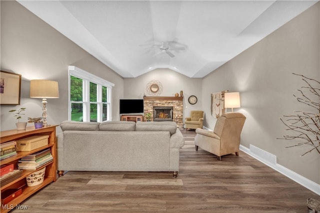 17360 Woodlawn Ct, Strongsville, OH 44149 - living area featuring a ceiling fan, lofted ceiling, a fireplace, wood finished floors, and baseboards