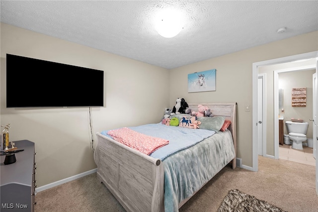 6270 Springwood Rd, Parma Heights, OH 44130 - carpeted bedroom with baseboards, a textured ceiling, and ensuite bath