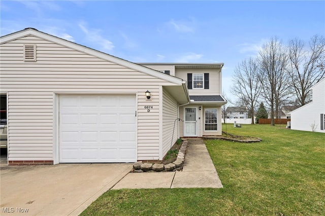 6874 Stratford Cir Unit D, Mentor, OH 44060 - view of front of house featuring concrete driveway and a front yard