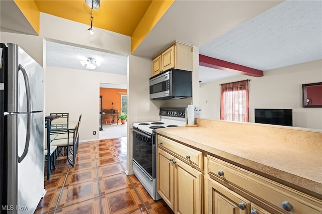 6874 Stratford Cir Unit D, Mentor, OH 44060 - kitchen with stainless steel appliances, a textured ceiling, light brown cabinetry, light countertops, and tile patterned floors