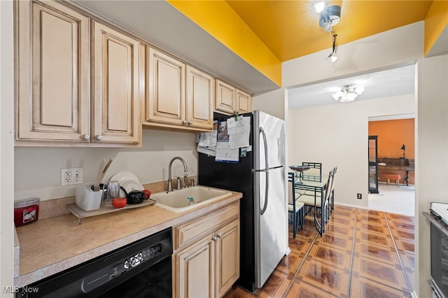 6874 Stratford Cir Unit D, Mentor, OH 44060 - kitchen featuring dishwasher, freestanding refrigerator, a sink, light countertops, and range with electric stovetop