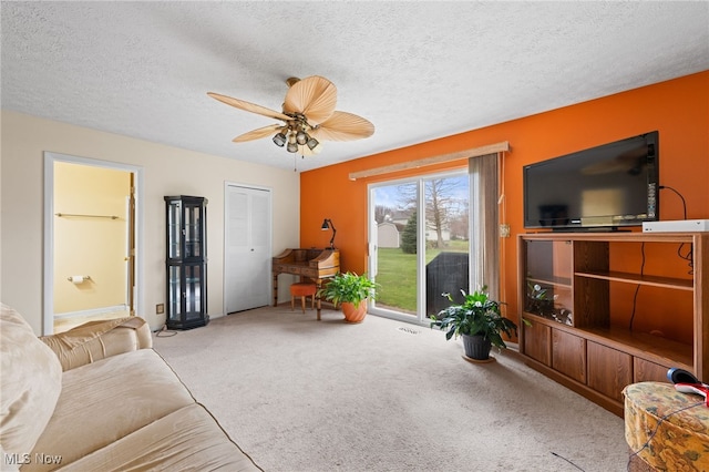 6874 Stratford Cir Unit D, Mentor, OH 44060 - living room featuring carpet floors, ceiling fan, and a textured ceiling