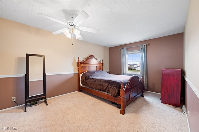 6874 Stratford Cir Unit D, Mentor, OH 44060 - bedroom with carpet floors, a ceiling fan, a textured ceiling, and baseboards
