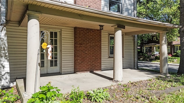 1023 Fulton Rd NW, Canton, OH 44703 - property entrance featuring brick siding and covered porch