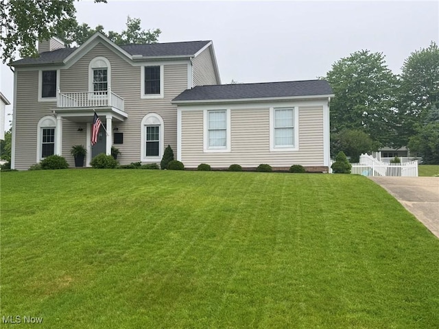 10957 Mogadore Ave NW, Uniontown, OH 44685 - colonial inspired home featuring a chimney and a balcony