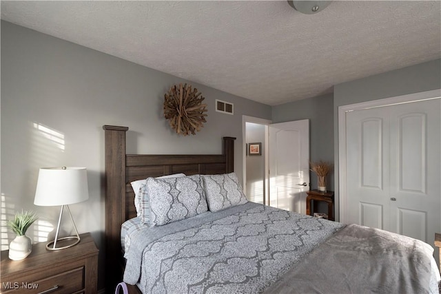 10957 Mogadore Ave NW, Uniontown, OH 44685 - bedroom with a textured ceiling and a closet