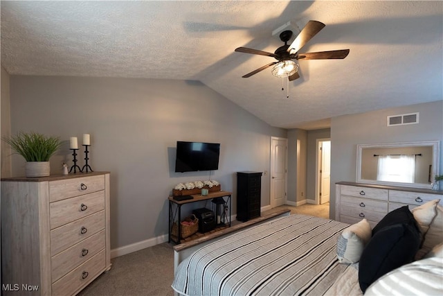 10957 Mogadore Ave NW, Uniontown, OH 44685 - bedroom with light colored carpet, baseboards, lofted ceiling, ceiling fan, and a textured ceiling
