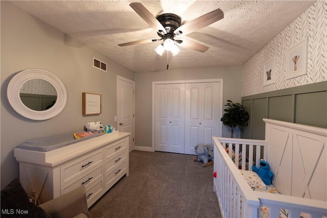10957 Mogadore Ave NW, Uniontown, OH 44685 - bedroom featuring dark carpet, a closet, a textured ceiling, and ceiling fan