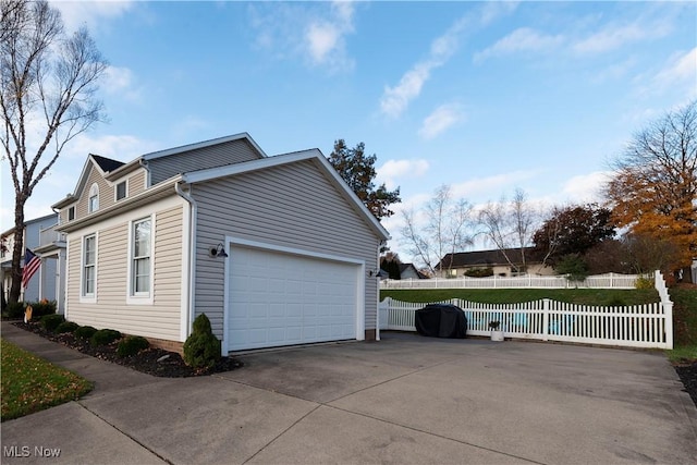 10957 Mogadore Ave NW, Uniontown, OH 44685 - view of property exterior featuring concrete driveway