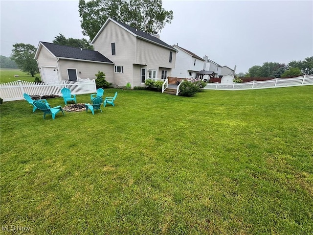 10957 Mogadore Ave NW, Uniontown, OH 44685 - back of house with a fire pit