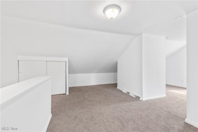 703 Annapolis Ave, Akron, OH 44310 - additional living space featuring lofted ceiling, carpet floors, and baseboards