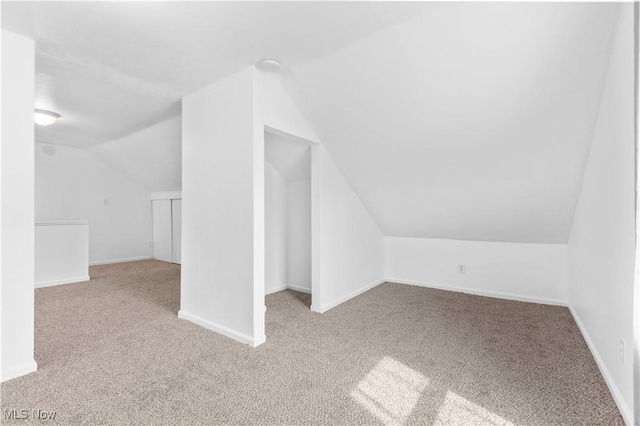703 Annapolis Ave, Akron, OH 44310 - additional living space featuring carpet, lofted ceiling, and baseboards