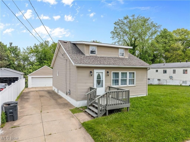 703 Annapolis Ave, Akron, OH 44310 - view of front of house with roof with shingles, a garage, a front yard, and an outdoor structure