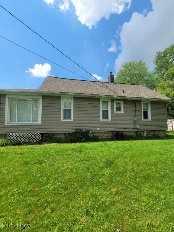 237 W Union St, Medina, OH 44256 - rear view of property featuring a yard and a chimney
