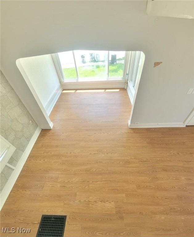 237 W Union St, Medina, OH 44256 - unfurnished living room featuring light wood-style flooring and baseboards