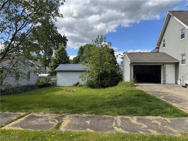 324 The Brooklands, Akron, OH 44305 - view of green lawn with concrete driveway and an attached garage