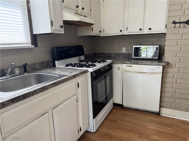 324 The Brooklands, Akron, OH 44305 - kitchen featuring dishwasher, range with gas stovetop, under cabinet range hood, a sink, and white cabinetry