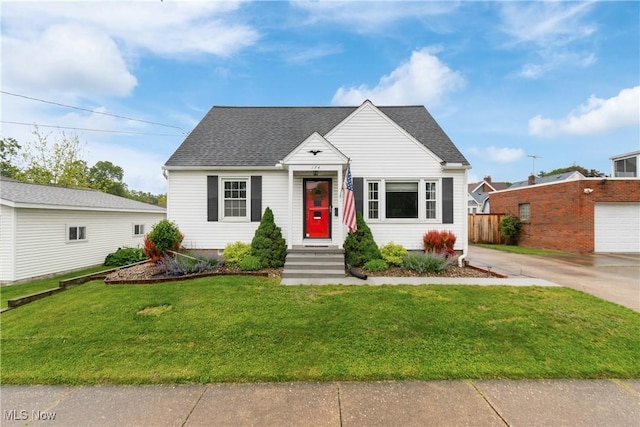 174 Woolf Ave, Akron, OH 44312 - view of front of property featuring roof with shingles, driveway, and a garage