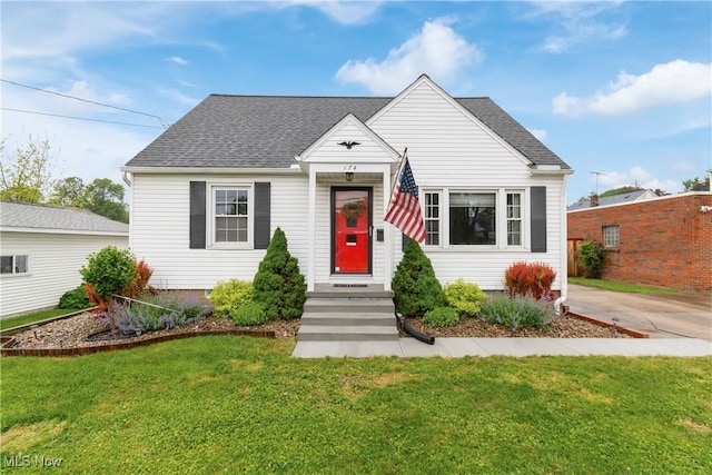 174 Woolf Ave, Akron, OH 44312 - bungalow-style house with a front lawn and a shingled roof