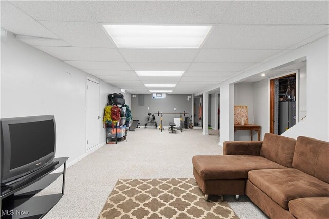 174 Woolf Ave, Akron, OH 44312 - living area with carpet floors, a paneled ceiling, baseboards, and water heater