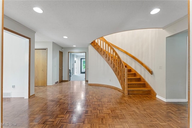 1820 Schneider St NW, North Canton, OH 44720 - unfurnished living room featuring baseboards, stairs, recessed lighting, and a textured ceiling