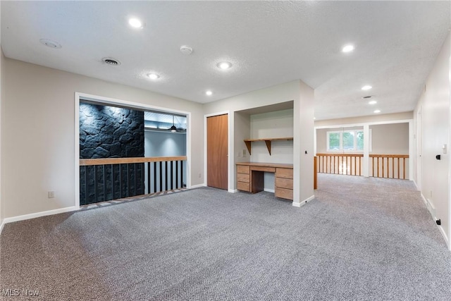 1820 Schneider St NW, North Canton, OH 44720 - unfurnished living room with carpet flooring, baseboards, and recessed lighting