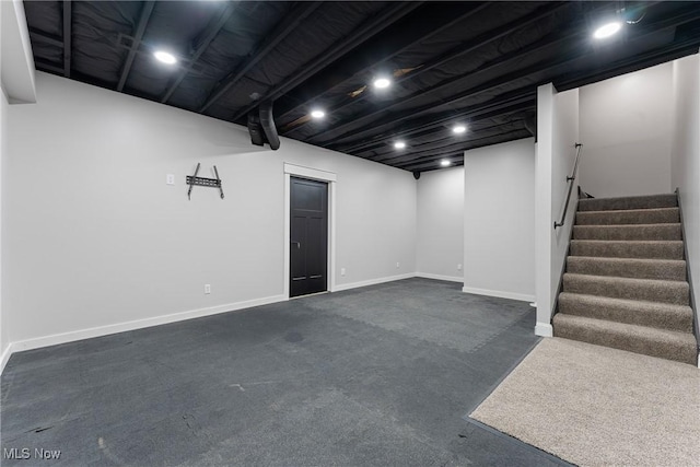 1820 Schneider St NW, North Canton, OH 44720 - finished below grade area featuring stairway, baseboards, and dark carpet