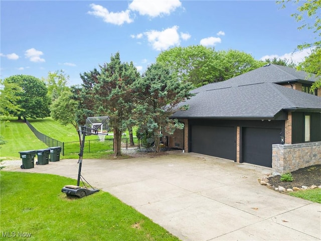 1820 Schneider St NW, North Canton, OH 44720 - view of front of home featuring a shingled roof, brick siding, and driveway