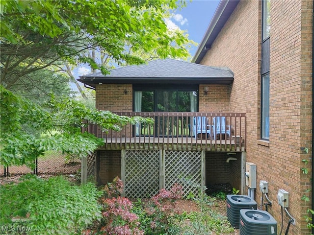 1820 Schneider St NW, North Canton, OH 44720 - rear view of house with a deck, central AC, and brick siding
